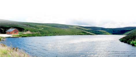 A view over the Loch to a small modern bothy